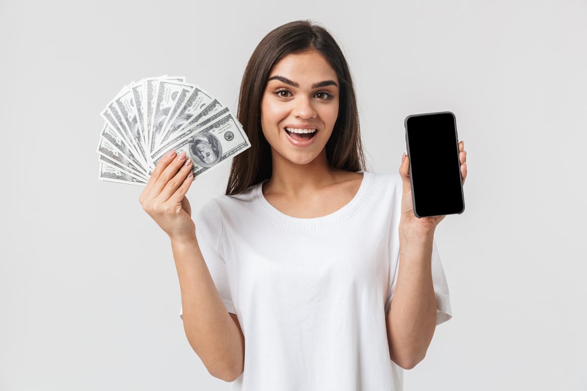 Happy Pretty Young Woman Holding Money Fan